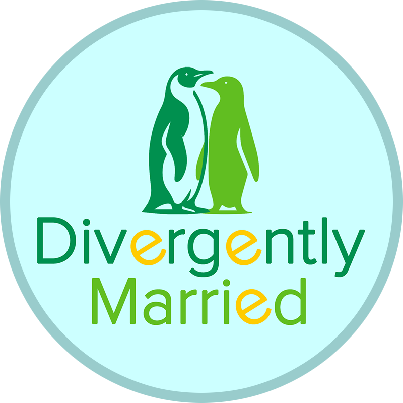 Divergently Married logo. It is a circle, with two penguins in different shades of green, facing each other, with the text of Divergently Married underneath this.